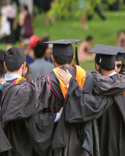 Cornell graduating seniors in caps and gowns