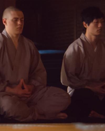 Cornell student meditating in Japanese temple